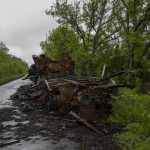 
              Debris from a military vehicle lies on the side of a road in northern Derhachi, eastern Ukraine, Sunday, May 15, 2022. (AP Photo/Bernat Armangue)
            