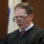 Boston Municipal Court Judge James Stanton addresses the court during the first day of the pandemic-delayed trial for celebrity chef Mario Batali, at Boston Municipal Court, Monday, May 9, 2022, in Boston. Batali pleaded not guilty to a charge of indecent assault and battery in 2019, stemming from accusations that he forcibly kissed and groped a woman after taking a selfie with her at a Boston restaurant in 2017. (AP Photo/Steven Senne, Pool)