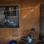 
              "No peace for the wicked " is written on Anayo Mbah's room in Umuida, Nigeria, Friday, Feb. 11, 2022. Mbah was in the final days of her sixth pregnancy when her husband, Jonas, fell ill with fever. By the time he was taken to a clinic, the motorcycle taxi driver was coughing up blood. He tested positive for COVID-19 and was still in the hospital when she gave birth days later. The baby would never meet her father. (AP Photo/Jerome Delay)
            