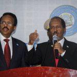 
              Hassan Sheikh Mohamud, right, speaks after his election win next to incumbent leader Mohamed Abdullahi Mohamed at the Halane military camp in Mogadishu, Somalia, Sunday, May 15, 2022. Former President Mohamud, who was voted out of power in 2017, has been returned to the nation's top office after defeating the incumbent leader in a protracted contest decided by legislators in a third round of voting late Sunday. (AP Photo/Farah Abdi Warsameh)
            