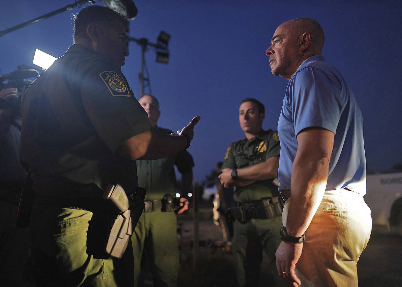 Homeland Security Secretary Alejandro Mayorkas listens to Raul Ortiz, Chief, U.S. Border Patrol, as...