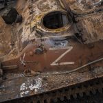 
              The letter Z, which has become the Russian emblem for the war, is seen on a blown Russian APC near Kutuzivka, east Ukraine, Friday, May 13, 2022. (AP Photo/Bernat Armangue)
            