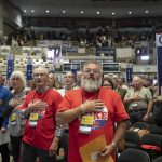 
              Delegates recite the "Pledge of Allegiance" to open the first day of the Minnesota State Republican Convention, Friday, May 13, 2022,  at the Mayo Civic Center in. Rochester, Minn. (Glen Stubbe/Star Tribune via AP)
            