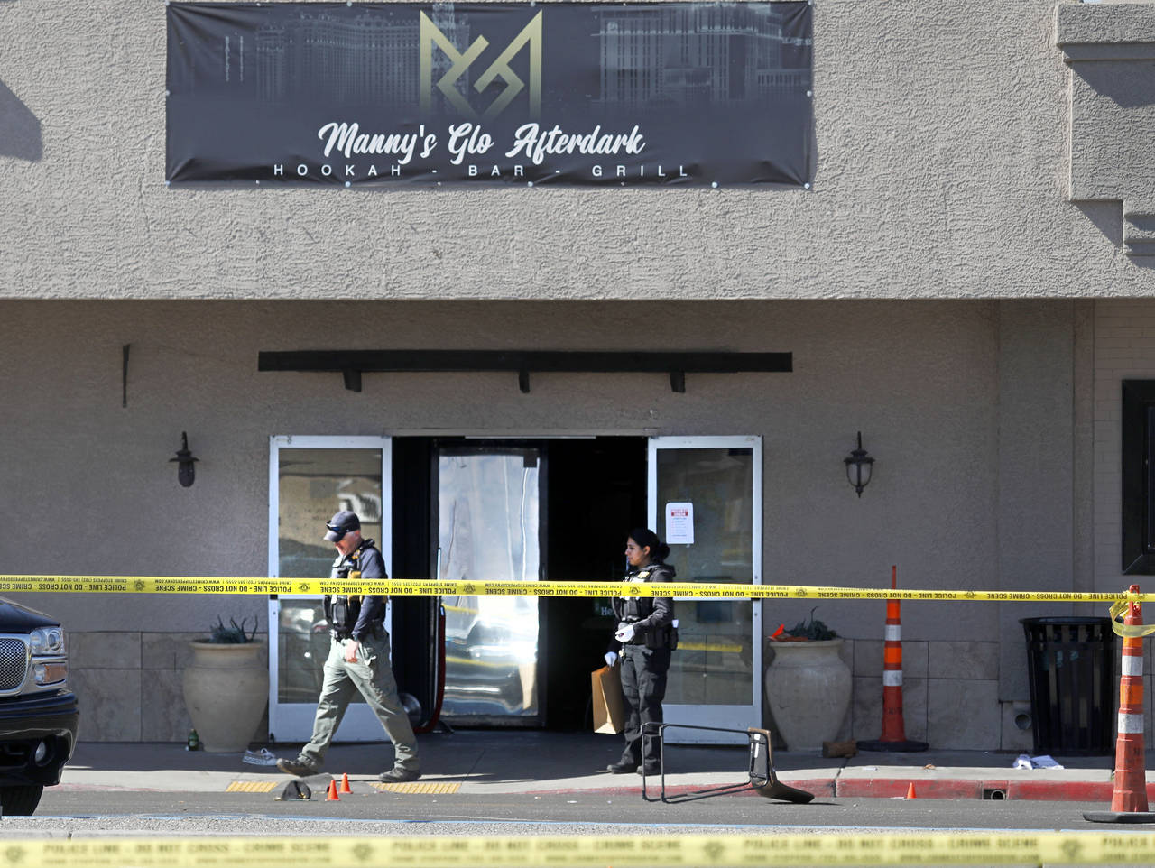 FILE - Las Vegas police investigate at Manny's Glow Ultra Lounge & Restaurant, after a shooting on ...