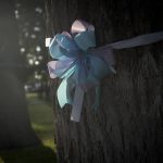 
              Sunlight illuminates ribbons that decorate trees at a memorial site in the town square on Friday, May 27, 2022, in Uvalde, Texas days after a deadly school shooting took the lives of 19 children and two teachers. (AP Photo/Wong Maye-E)
            