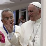 
              FILE - Small drops of blood stain Pope Francis' white cassock as he speaks with Jorge Enrique Jimenez Carvajal, emeritus archbishop of Cartagena after knocking his face next to his eye on the popemobile in Cartagena, Colombia, Sunday, Sept. 10, 2017. Pope Francis said Sunday, May 29, 2022 he has tapped 21 churchmen to become cardinals, most of them from continents other than Europe, which has dominated Catholic hierarchy for most of the church's history. (AP Photo/Andrew Medichini, File)
            