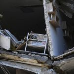 
              A child's bed is seen inside an apartment building damaged by Russian shelling in Bakhmut, Donetsk region, Ukraine, Thursday, May 12, 2022. (AP Photo/Andriy Andriyenko)
            