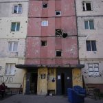 
              A resident sits outside a house ruined by shelling in Irpin, outskirts of Kyiv, Ukraine, Tuesday, May 24, 2022. (AP Photo/Natacha Pisarenko)
            