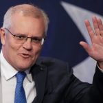 
              Australian Prime Minister Scott Morrison waves as he arrives at a Liberal Party function in Sydney, Australia, Saturday, May 21, 2022. Morrison has conceded defeat and has confirmed that he would hand over the leadership of the Liberal Party following his party's loss to Labor's in today's federal election. (AP Photo/Mark Baker)
            