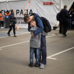 
              FILE - Andrii Fedorov hugs his son Makar as they reunited at a reception center for displaced people in Zaporizhzhia, Ukraine, Monday, May 2, 2022. Makar and his mother Dariia Fedora fled from Mariupol. (AP Photo/Francisco Seco, File)
            