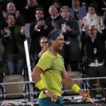 
              Spain's Rafael Nadal celebrates winning his quarterfinal match against Serbia's Novak Djokovic in four sets, 6-2, 4-6, 6-2, 7-6 (7-4), at the French Open tennis tournament in Roland Garros stadium in Paris, France, Wednesday, June 1, 2022. (AP Photo/Christophe Ena)
            