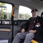 
              CORRECTS SPELLING OF NAME TO GLADDEN NOT GLADEN British veteran Bill Gladden arrives in a British Taxi Charity for Military Veterans to the ceremony at Pegasus Bridge, in Ranville, Normandy, Sunday, June, 5, 2022. On Monday, the Normandy American Cemetery and Memorial, home to the gravesites of 9,386 who died fighting on D-Day and in the operations that followed, will host U.S. veterans and thousands of visitors in its first major public ceremony since 2019. (AP Photo/Jeremias Gonzalez)
            