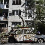 
              A destroyed car lies next to an apartment building damaged by an overnight missile strike in Sloviansk, Ukraine, Tuesday, May 31, 2022. (AP Photo/Andriy Andriyenko)
            