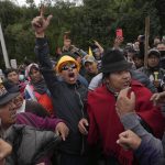 
              Demonstrators protest against the government of President Guillermo Lasso in Tambillo, Ecuador, Monday, June 20, 2022. (AP Photo/Dolores Ochoa)
            