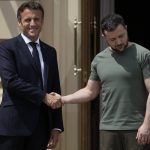 
              French President Emmanuel Macron, left, shakes hands with Ukrainian President Volodymyr Zelenskyy at the Mariyinsky Palace in Kyiv, Ukraine, Thursday, June 16, 2022. Four European leaders, of France, Italy, Germany and Romania, made a high-profile visit to Ukraine, where they were saw the ruins of a Kyiv suburb on Thursday and denounced the brutality of a Russian invasion that has killed many civilians. (AP Photo/Natacha Pisarenko)
            