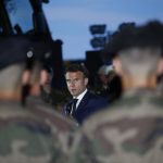 
              French President Emmanuel Macron speaks to French soldiers at the Mihail Kogalniceanu Air Base, near the city of Constanta, Romania, Tuesday, June 14, 2022. French President Emmanuel Macron is set to hold bilateral talks with officials and meet with French troops who are part of NATO's response to Russia's invasion of Ukraine. France has around 500 soldiers deployed in Romania and has been a key player in NATO's bolstering of forces on the alliance's eastern flank following Russia's invasion on Feb. 24. (Yoan Valat, Pool via AP)
            