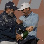 
              Hennie Du Plessis of South Africa, left and Charles Schwartzel of South Africa teammates of the winning Stinger team celebrate with champagne on the winners podium during presentation ceremony at the inaugural LIV Golf Invitational at the Centurion Club in St Albans, England, Saturday, June 11, 2022.Charles Schwartzel of South Africa, won the individual title and his team won the team title. (AP Photo/Alastair Grant)
            