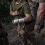 
              An injured Ukrainian serviceman is evacuated to an aid station in a town near the frontline in Donetsk oblast region, eastern Ukraine, Sunday, June 5, 2022. (AP Photo/Bernat Armangue)
            