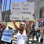
              Activists rally in front of City Hall, Saturday, June 25, 2022, in Los Angeles, as they protest the Supreme Court's ruling on abortion. (Keith Birmingham/The Orange County Register via AP)
            
