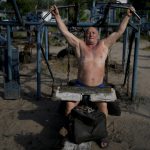 
              A man exercise in Kyiv, Ukraine, Thursday, June 9, 2022. (AP Photo/Natacha Pisarenko)
            