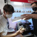 
              A customer views samples of marijuana before making a purchase at the Highland Cafe in Bangkok, Thailand, Thursday, June 9, 2022. Measures to legalize cannabis became effective Thursday, paving the way for medical and personal use of all parts of cannabis plants, including flowers and seeds. (AP Photo/Sakchai Lalit)
            