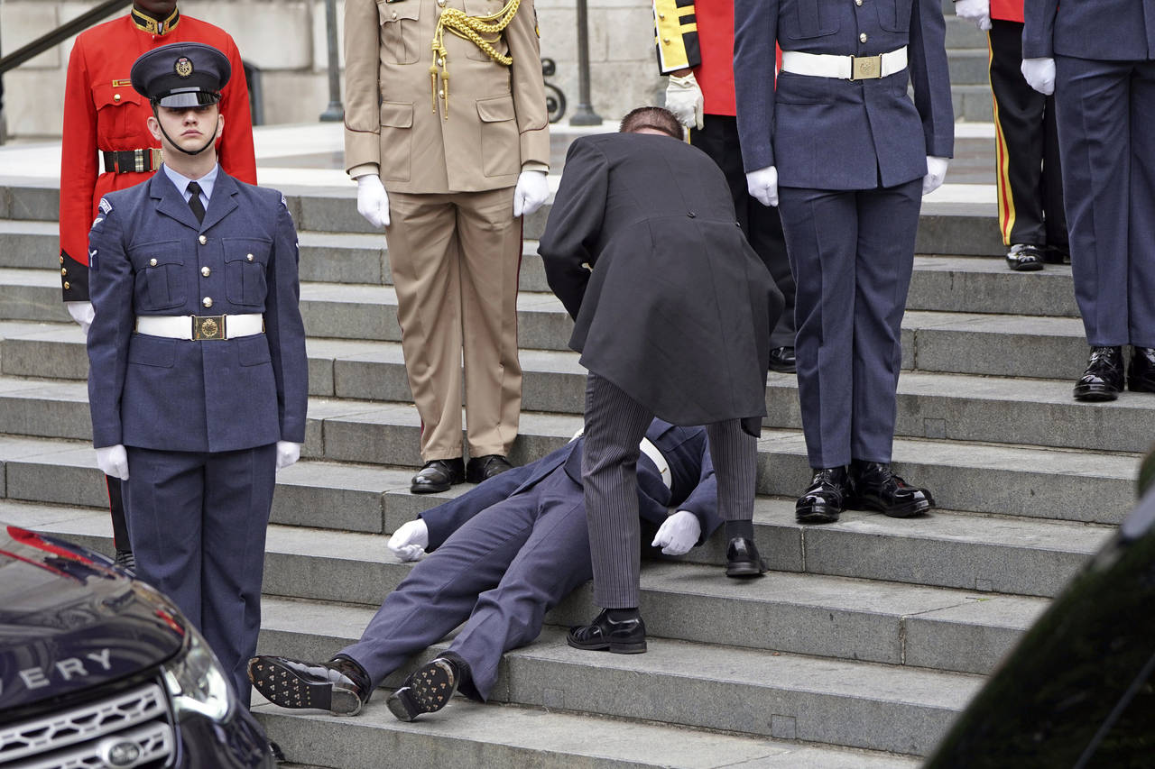 A Military personnel faints ahead of service of thanksgiving for the reign of Queen Elizabeth II at...
