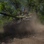 
              Ukrainian servicemen maneuver a tank near the frontline in Donetsk region, eastern Ukraine, Monday, June 6, 2022. (AP Photo/Bernat Armangue)
            