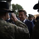 
              French President Emmanuel Macron greets U.S soldiers as he arrives at the Mihail Kogalniceanu Air Base, near the city of Constanta, Romania, Tuesday, June 14, 2022. French President Emmanuel Macron is set to hold bilateral talks with officials and meet with French troops who are part of NATO's response to Russia's invasion of Ukraine. France has around 500 soldiers deployed in Romania and has been a key player in NATO's bolstering of forces on the alliance's eastern flank following Russia's invasion on Feb. 24. (Yoan Valat, Pool via AP)
            