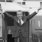 FILE - Richard Nixon says goodbye with a victorious salute to his staff members outside the White House as he boards a helicopter after resigning the presidency on Aug. 9, 1974. The traumas of Watergate and Jan. 6 are a half century apart, in vastly different eras, and they were about different things. But in both episodes, a president tried to do an end run around democracy. Friday is the 50th anniversary of the Watergate break-in that eventually consumed Richard Nixon's presidency.  (AP Photo/Bob Daugherty, File)