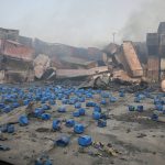 
              Containers of chemicals lie scattered after explosion at the BM Inland Container Depot, where a fire broke out around midnight Saturday in Chittagong, about 210 kilometers (130 miles) southeast of, Dhaka, Bangladesh, Monday, June 6, 2022. Dozens of people were killed and more than 100 others were injured after the inferno broke out following explosions in a container full of chemicals. (AP Photo)
            