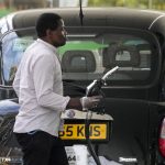 
              A driver takes a nozzle to fill up his car with fuel in London, Thursday, June 9, 2022. The average cost of filling up a typical family car has exceeded 100 pounds ($125) for the first time in Britain, as Russia's war in Ukraine drives gasoline prices higher. (AP Photo/Frank Augstein)
            