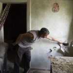 
              A man inspects his house damaged by the Russian shelling in Bakhmut, Donetsk region, Ukraine, Sunday , June 26, 2022.(AP Photo/Efrem Lukatsky)
            