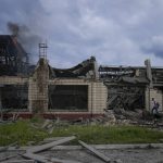 
              Smokes raises from a railway service facility hit by a Russian missile strike in Kyiv, Ukraine, Sunday, June 5, 2022. (AP Photo/Natacha Pisarenko)
            