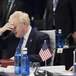 
              British Prime Minister Boris Johnson reacts at the start of the second plenary session of the NATO summit in Madrid, Wednesday, June 29, 2022. North Atlantic Treaty Organization heads of state will meet for a NATO summit in Madrid from Tuesday through Thursday. (Eliot Blondet, Pool via AP)
            