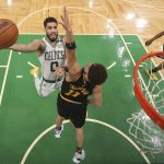 
              Boston Celtics forward Jayson Tatum (0) goes up for a shot against Golden State Warriors guard Klay Thompson (11) during Game 4 of basketball's NBA Finals, Friday, June 10, 2022, in Boston. (Kyle Terada/Pool Photo via AP)
            