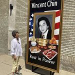 
              Activist and author Helen Zia poses Thursday, June 15, 2022, next to a painting of Vincent Chin in Detroit. The city is partnering with The Vincent Chin 40th Remembrance & Rededication Coalition to honor civil rights efforts that began with Chin's 1982 slaying. Chin, a Chinese American, was beaten to death in Detroit by two white men who never served jail time. The commemoration comes as hate crimes against Asian Americans are on the rise in the U.S. (AP Photo/Corey Williams)
            