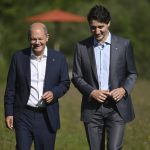 
              German Chancellor Olaf Scholz, left, and the Prime Minister of Canada, Justin Trudeau, right, take a walk during their bilateral meeting on the sidelines of the G7 summit at Castle Elmau in Kruen, near Garmisch-Partenkirchen, Germany, on Monday, June 27, 2022. The Group of Seven leading economic powers are meeting in Germany for their annual gathering Sunday through Tuesday. . (Kerstin Joensson/Pool Photo via AP)
            