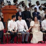 
              President-elect Ferdinand "Bongbong" Marcos Jr. and his family attend the inauguration ceremony at National Museum on Thursday, June 30, 2022 in Manila, Philippines. Marcos was sworn in as the country's 17th president. (AP Photo/Aaron Favila)
            