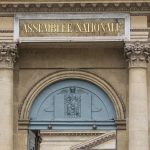 
              The logo of the National Assembly is photographed at the entrance gate in Paris, Monday, June 20, 2022. Many voters in Sunday's poll voted for far-right or far-left candidates, denying President Emmanuel Macron's centrist alliance a straight majority in the National Assembly. (AP Photo/Michel Euler)
            