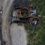 
              The gutted remains of a tank lie by a road in Lypivka, on the outskirts of Kyiv, Ukraine, Tuesday, June 14, 2022. (AP Photo/Natacha Pisarenko)
            