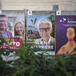 
              FILE - A campaign poster of the French Animalist Party is displayed next to other candidates posters, in Lyon, central France, Tuesday, June 7, 2022. French voters were choosing lawmakers in a parliamentary election Sunday, June 12, 2022 as President Emmanuel Macron seeks to secure his majority while under growing threat from a leftist coalition. (AP Photo/Laurent Cipriani, File)
            
