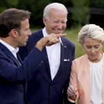 
              From left, French President Emmanuel Macron, U.S. President Joe Biden and European Commission President Ursula von der Leyen after the official G7 group photo at Castle Elmau in Kruen, near Garmisch-Partenkirchen, Germany, on Sunday, June 26, 2022. The Group of Seven leading economic powers are meeting in Germany for their annual gathering Sunday through Tuesday. (AP Photo/Matthias Schrader)
            