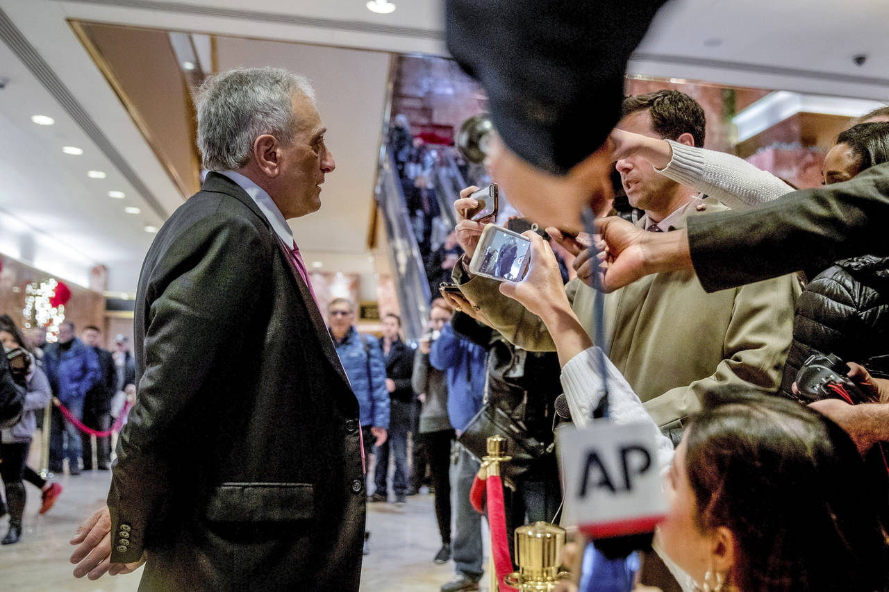 FILE - Carl Paladino, left, speaks to members of the media at Trump Tower, on Dec. 5, 2016, in New ...