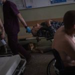 
              Ukrainian injured servicemen and an injured civilian wait for medical treatment in the Donetsk region, eastern Ukraine, Tuesday, June 7, 2022. (AP Photo/Bernat Armangue)
            