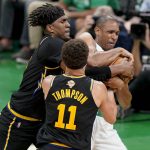 
              Boston Celtics center Al Horford (42) battles for a rebound against Golden State Warriors center Kevon Looney (5) and guard Klay Thompson (11) during the second quarter of Game 3 of basketball's NBA Finals, Wednesday, June 8, 2022, in Boston. (AP Photo/Steven Senne)
            