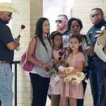 
              Guests leave Sacred Heart Catholic Church following the joint funeral service for Irma Garcia and husband Joe Garcia, Wednesday, June 1, 2022, in Uvalde, Texas. Irma Garcia was killed in last week's elementary school shooting; Joe Garcia died two days later. (AP Photo/Eric Gay)
            