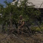 
              A Ukrainian serviceman patrols a village near the frontline in the Donetsk oblast region, eastern Ukraine, Thursday, June 2, 2022. (AP Photo/Bernat Armangue)
            