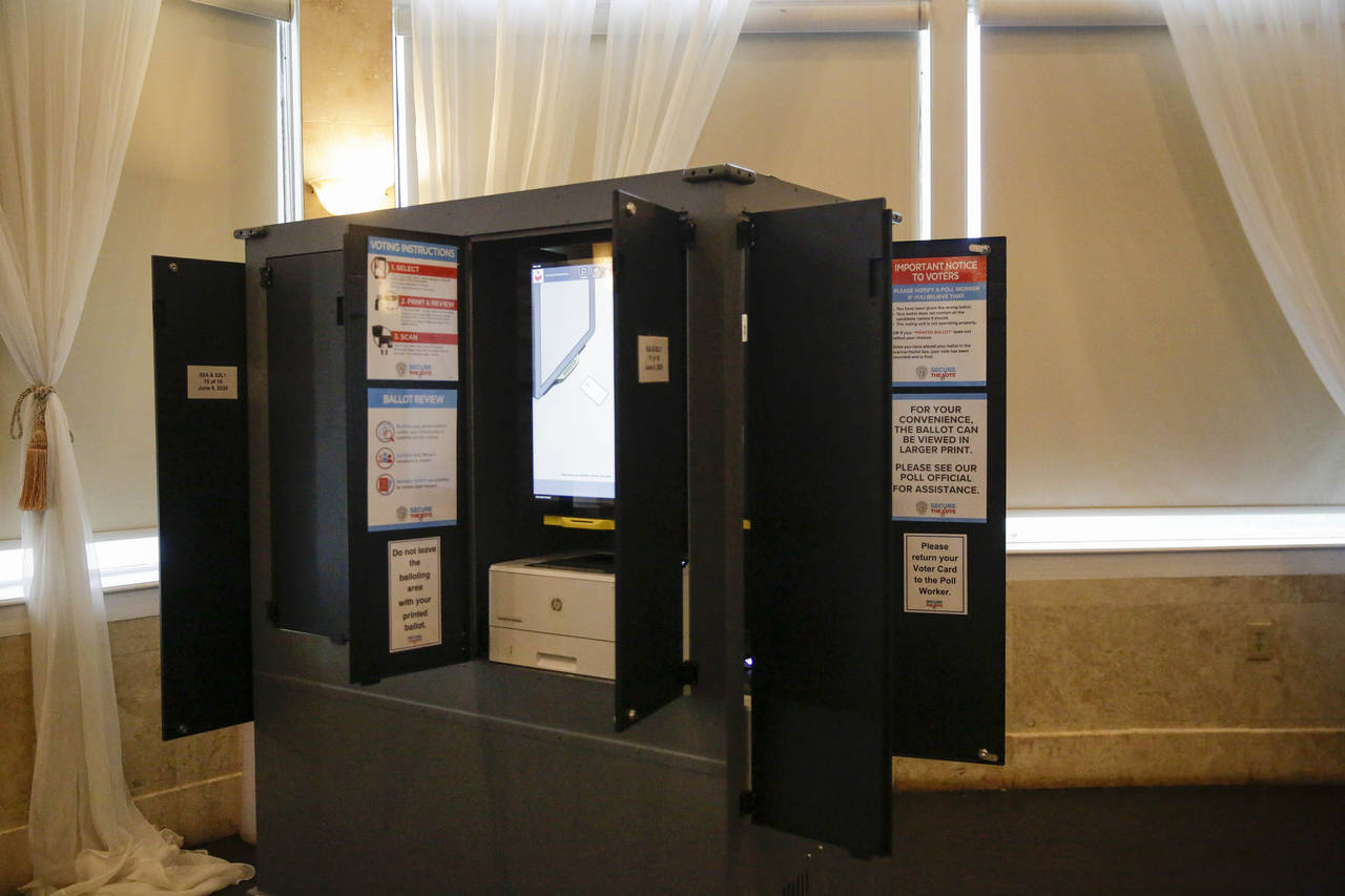 FILE - New state-issued voting machines used for the Georgia primary election on June 9, 2020, are ...