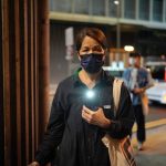 
              Pro-democracy protester holds an illuminated cell phone near Hong Kong's Victoria Park, Saturday, June 4, 2022. Dozens of police patrolled Hong Kong’s Victoria Park on Saturday after authorities for a third consecutive year banned public commemoration of the anniversary of the deadly Tiananmen Square crackdown in 1989, with vigils overseas the only place marking the event. (AP Photo/Kin Cheung)
            