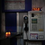 
              LED candles are displayed by a protester at a phone booth near the Hong Kong's Victoria Park, Saturday, June 4, 2022. Heavy police force patrolled Hong Kong's Victoria Park on Saturday after authorities for a third consecutive year banned public commemoration of the anniversary of the deadly Tiananmen Square crackdown in 1989, with vigils overseas the only place marking the event. (AP Photo/Kin Cheung)
            